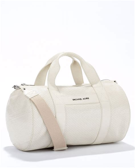 michael kors white duffel bag|Michael Kors travel suitcase.